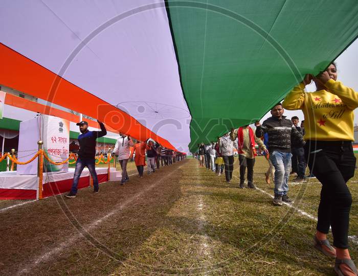 Youth  carry a 100ft long Tricolour  on the occasion of 72nd Republic Day at Nurul Amin stadium parade ground in  Assam on Jan 26,2021