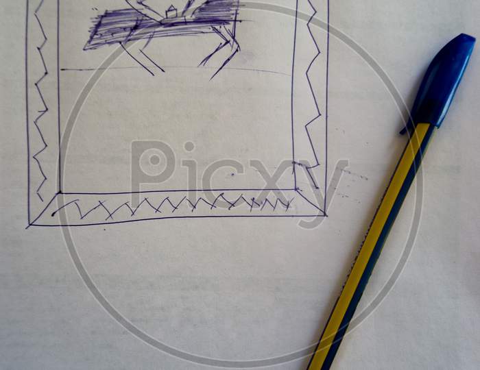 Child Hood Drawing In The Book , In This Image Is One Man Sitting In The Table