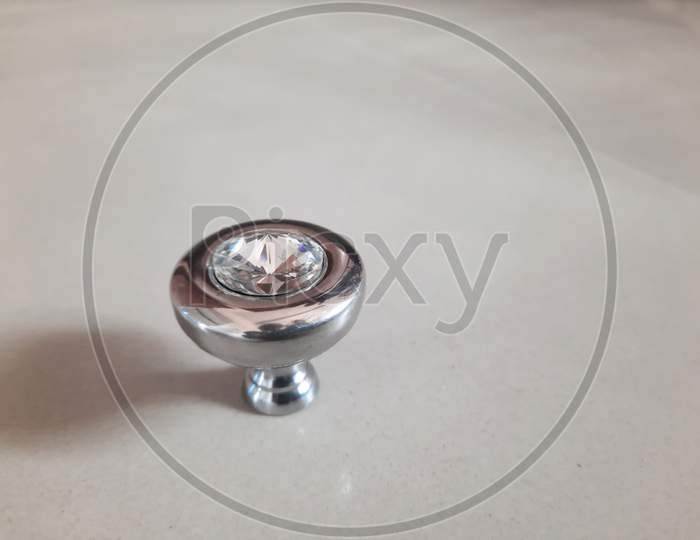 Circular Drawer Knob Design With Diamond In Stainless Steel Isolated On White