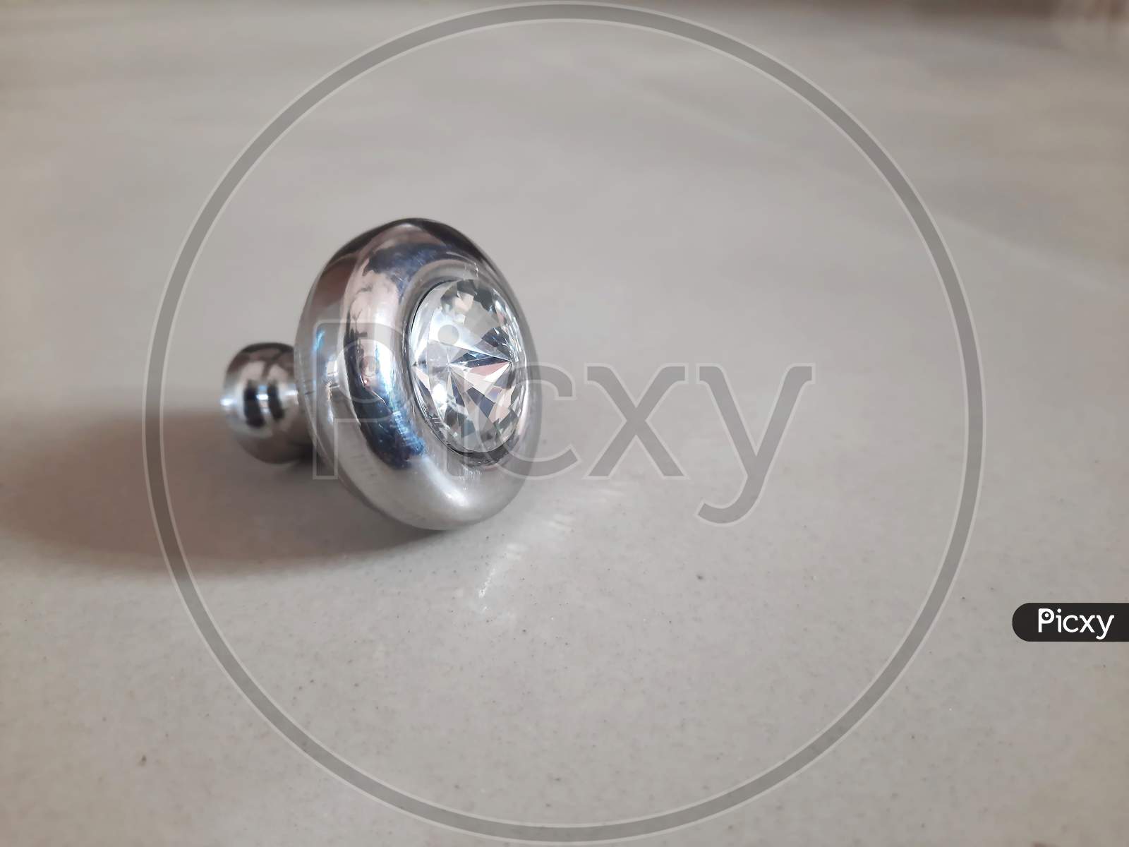 Circular Drawer Knob Design With Diamond In Stainless Steel Isolated On White