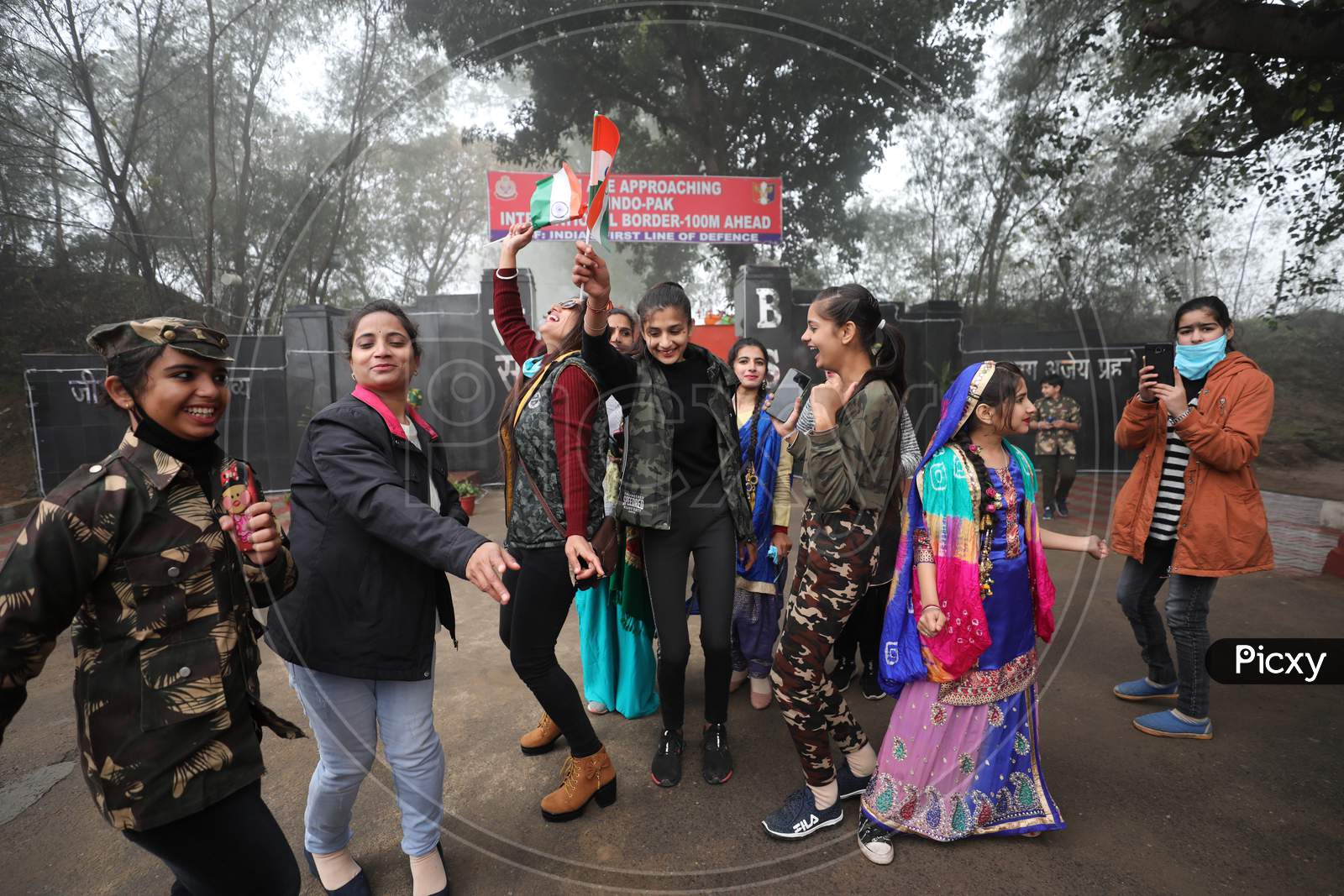 Vistors dance on the occasion of 72nd Republic Day celebrations at octroi post in Suchatgarh International border in Jammu,26 Jan,2021.