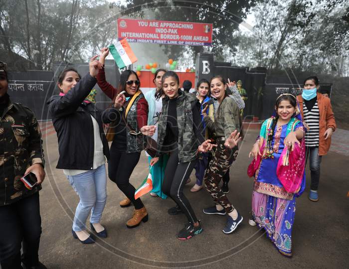 Vistors dance on the occasion of 72nd Republic Day celebrations at octroi post in Suchatgarh International border in Jammu,26 Jan,2021.