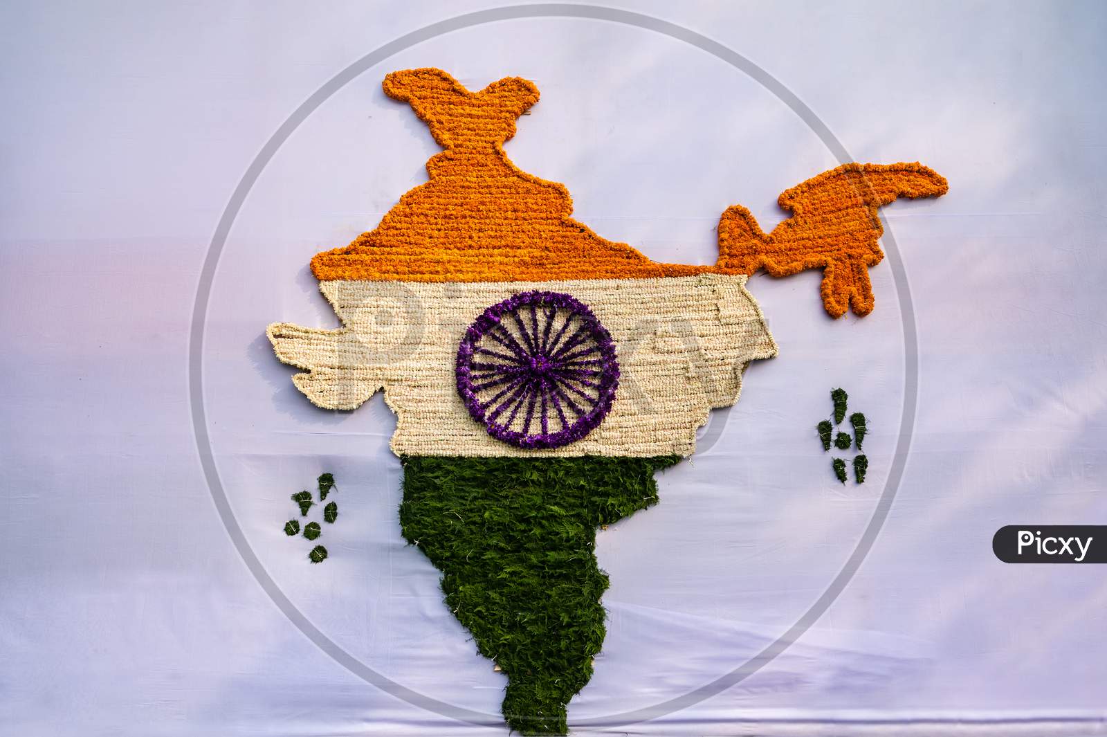 Indian map made of tricolor flowers on cloth on the occasion of Republic day.