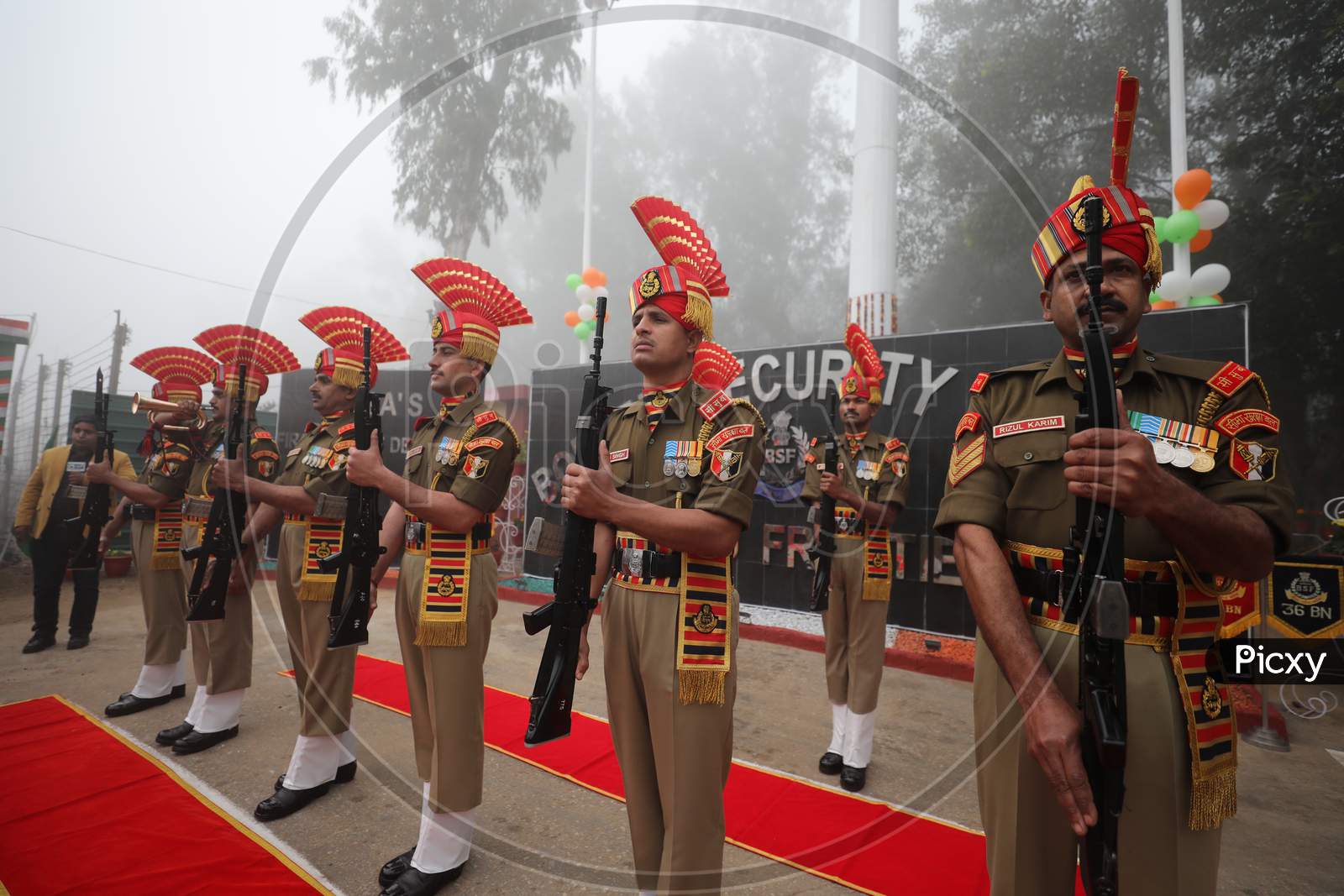 BSF soldiers salutes after hoisting the National Flag on the occasion of 72nd Republic Day celebrations at octroi post in Suchatgarh International border in Jammu ,26 Jan,2021.