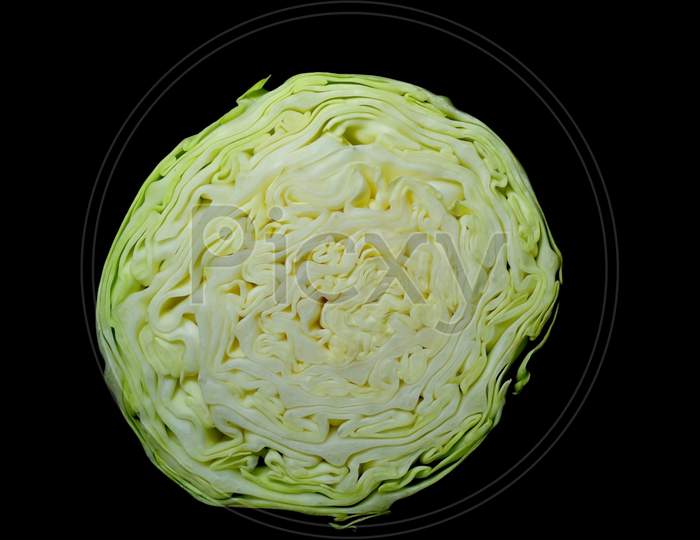 half cut cabbage with black background