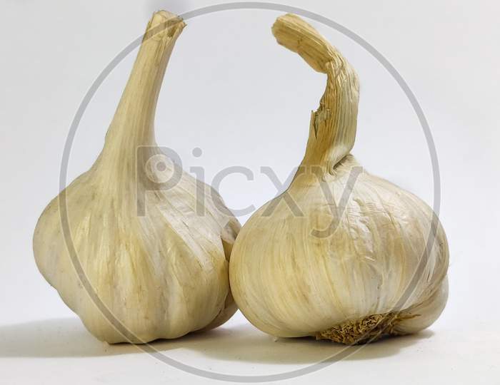 Fresh Garlic On A White Isolated Surface