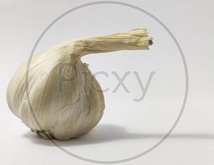 Fresh Garlic On A White Isolated Surface