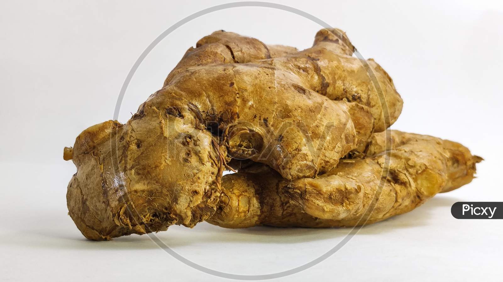 Fresh Ginger On A White Isolated Surface