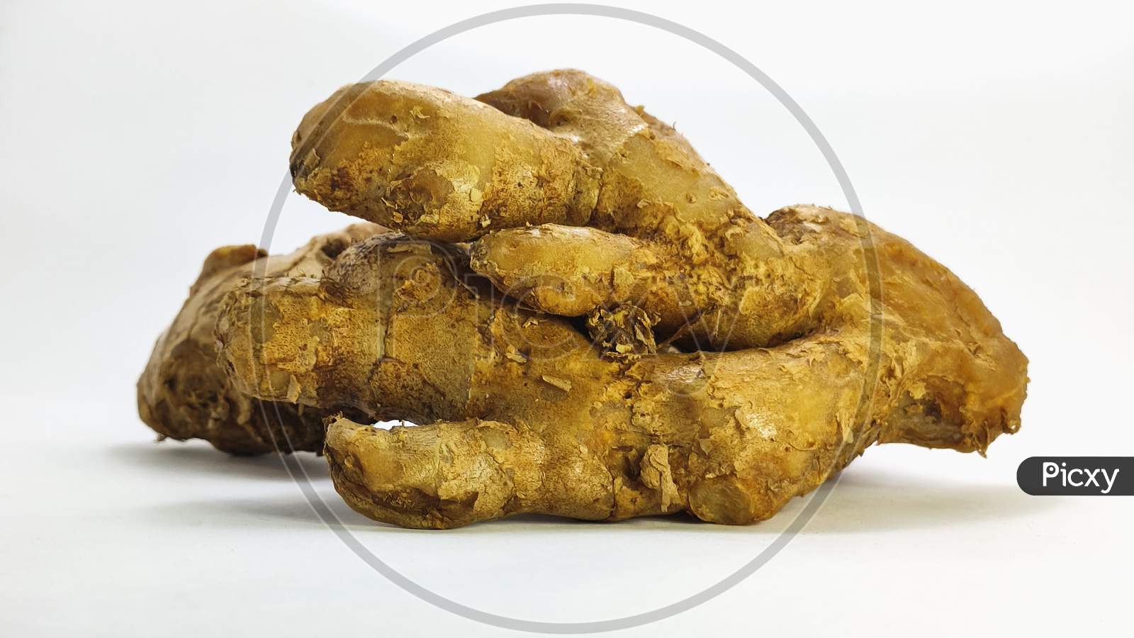 Fresh Ginger On A White Isolated Surface