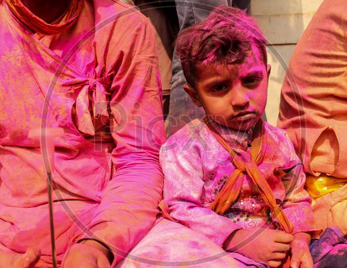 Mathura, Uttar Pradesh, India- January 28 2020: Potrait Of A Young Kid Covered Fully In Colors Of Holi In Mathura.