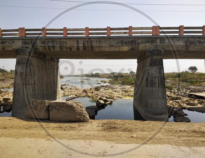 Januari,24,2021,Mandavdhar,gujrat,india:-This photo is of the bridge of Mandavadhar under which water is flowing in the beautiful Ghelo river