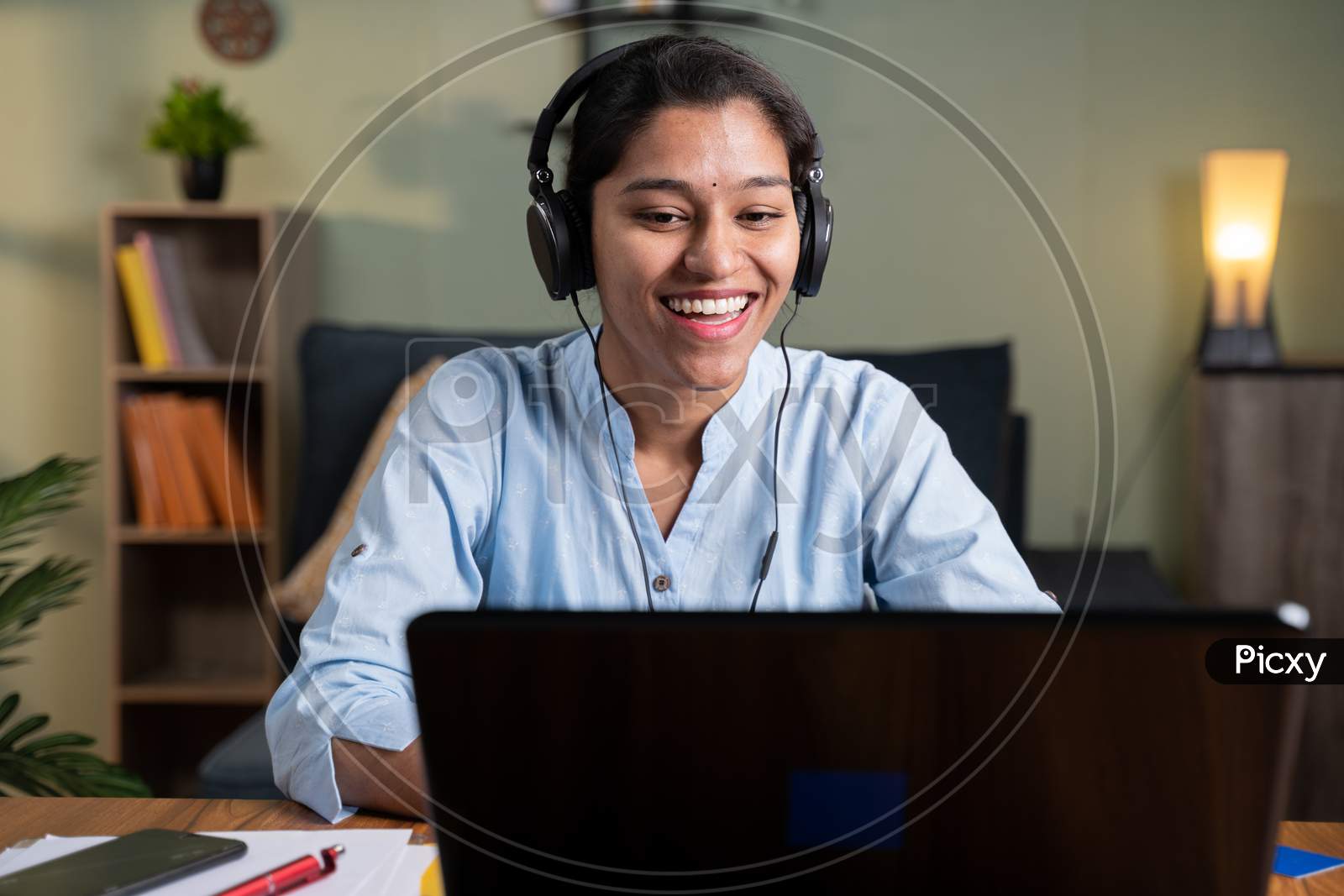 Happy Smiling Young Business Woman With Headphone In Video Call On Laptop Busy Talking - Concept Of Online Chat, Distance Webinar, Video Conference During Work From Home.