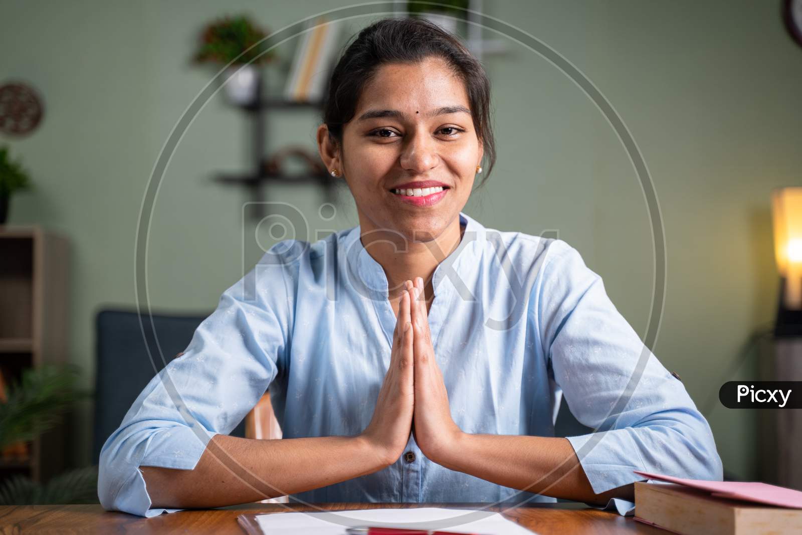 Image of Pov Shot Of Young Business Woman Doing Namaste Gesture To Camera -  Concept Of Video Chat, Conference Or Vlogging From Home By Looking At  Camera.-PI635344-Picxy