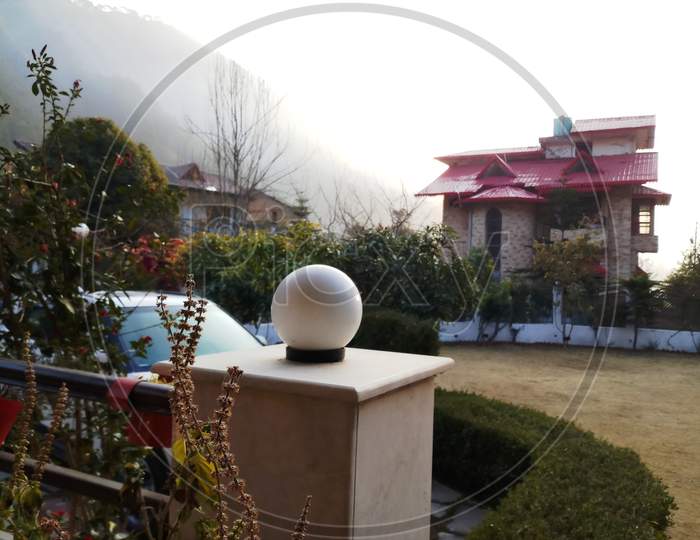 View of mountain-lighting globe-lawn-cottage