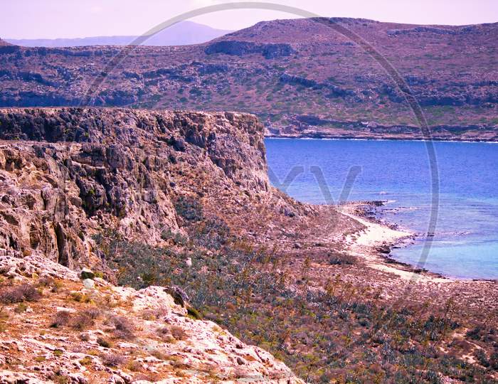 Rocky Terrain Landscape View Off The Island Of Imeri Gramvousa, Crete, Greece On Mediterranean Sea During Summer