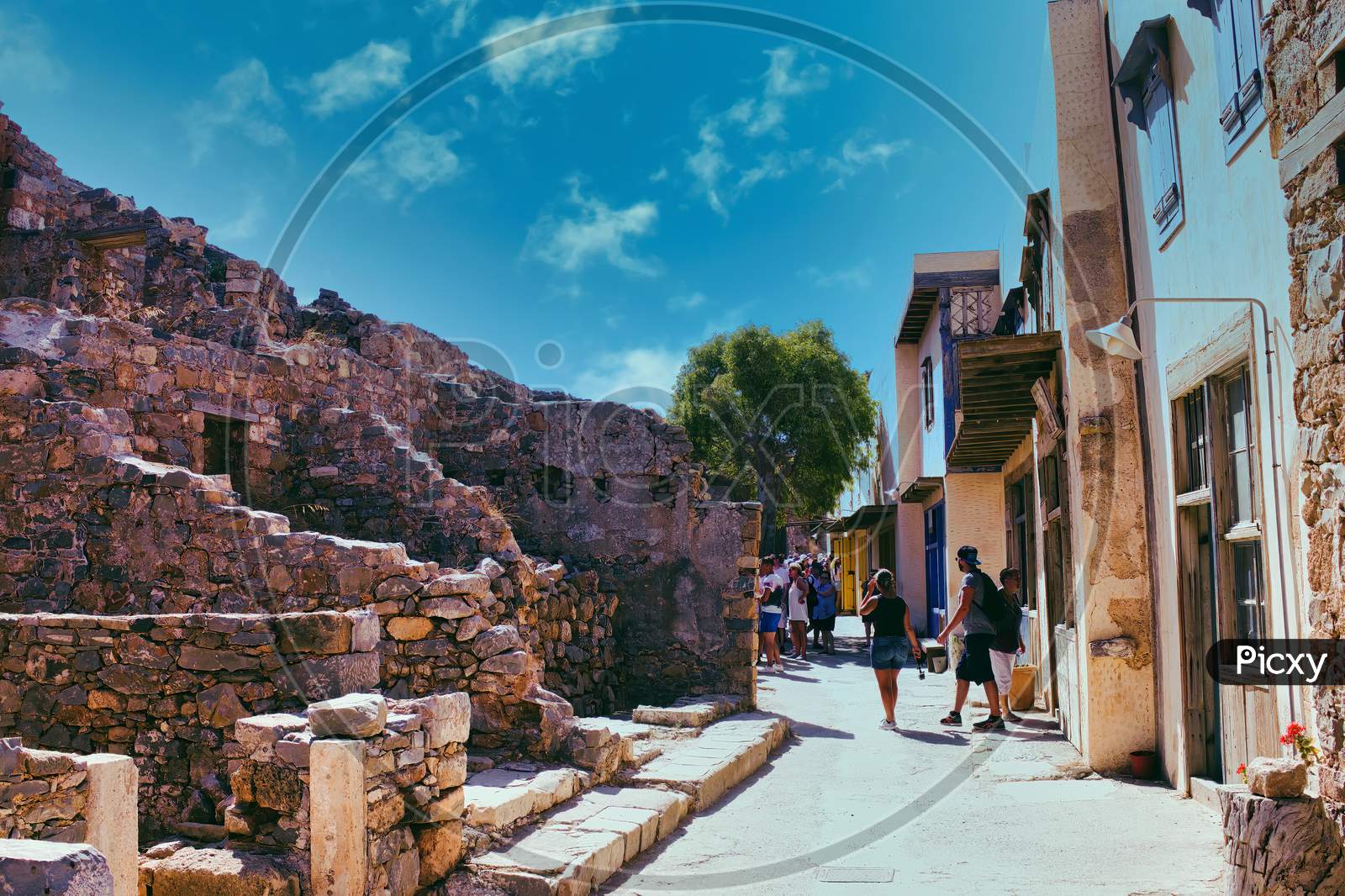Crete Or Kreta, Greece - September 14, 2017: Tourists Walking Around Walking Around The Castle Of Spinalonga Island, Former Leper Colony, In Mirabello Bay, Lasithi Prefecture