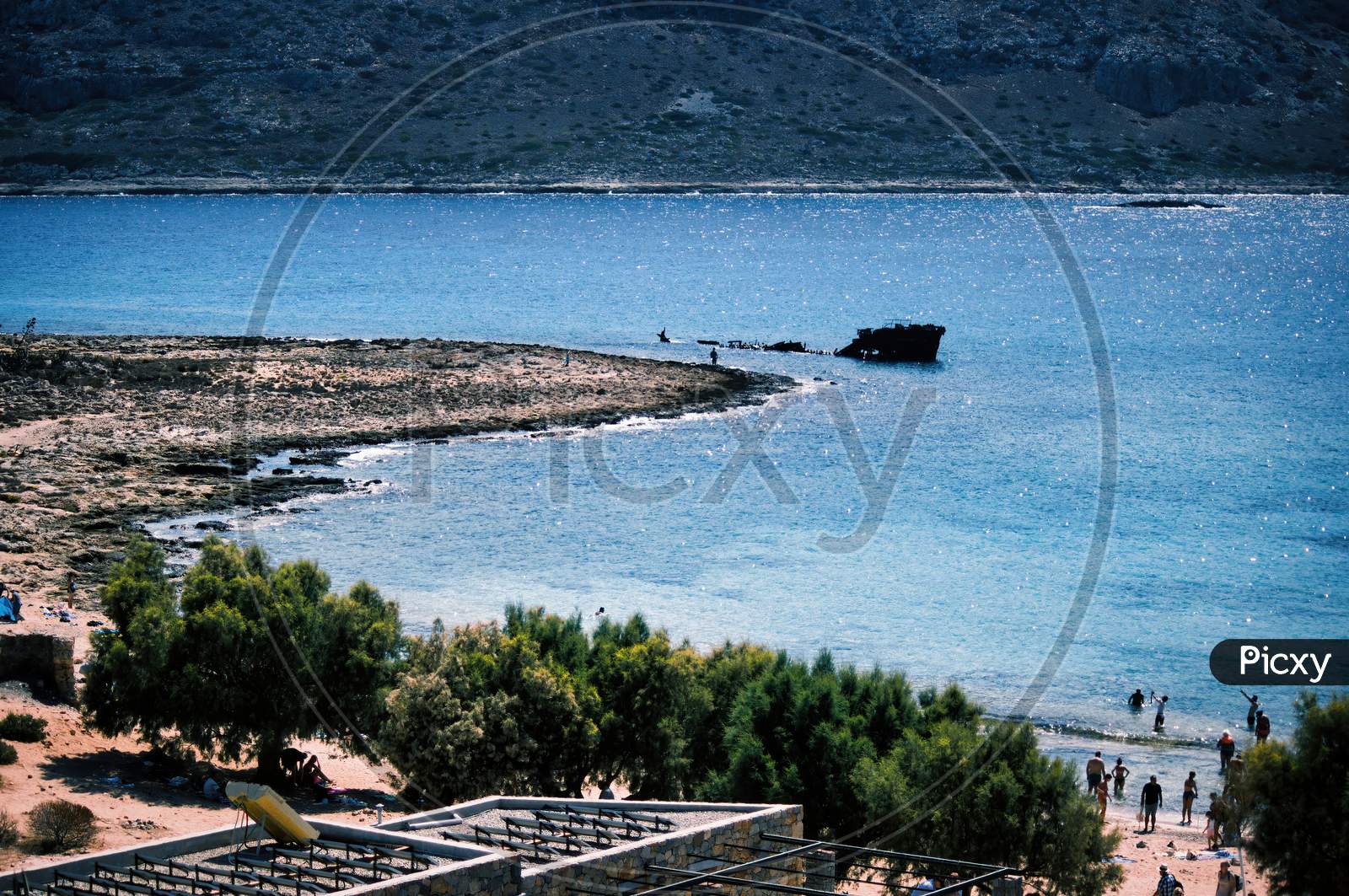 Rusty Shipwreck Off The Island Of Imeri Gramvousa, Crete, Greece On Mediterranean Sea During Summer