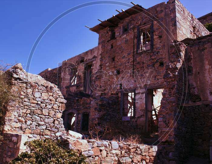 Crete Or Kreta, Greece - September 14, 2017: Wide Angle View Of The Castle Of Spinalonga Island Prison Ruin, Former Leper Colony, In Mirabello Bay, Lasithi Prefecture