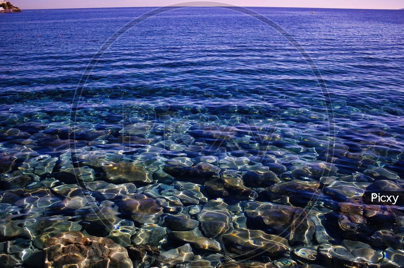 Crete Island, Greece: Clean See Through Transparent Water Of Mediterranean Sea With Gentle Waves.