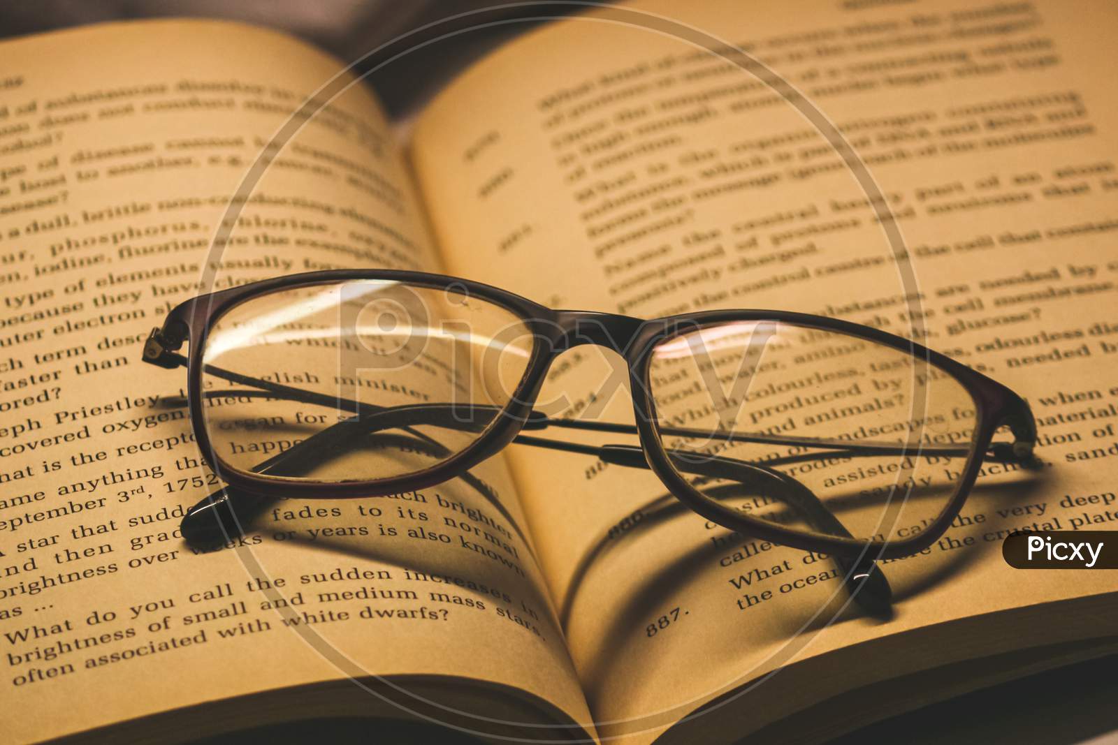 closeup of glasses(spectacles) on the  book