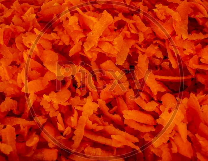 Top View Of Grated Carrot Which Is Rich In Vitamin A. Shredded Carrot Pieces