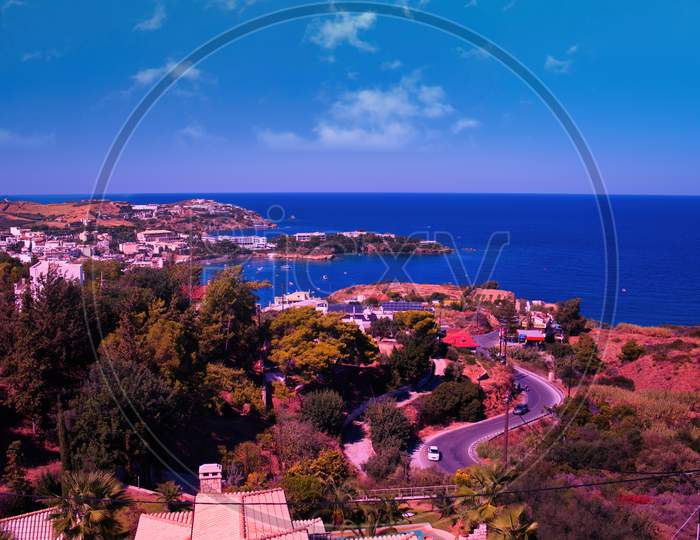 Crete Or Kreta Island, Greece: Wide Angle Shot Of A Roads In Heraklion City In Crete Island Against Blue Mediterranean Sea. Crete Cityscape