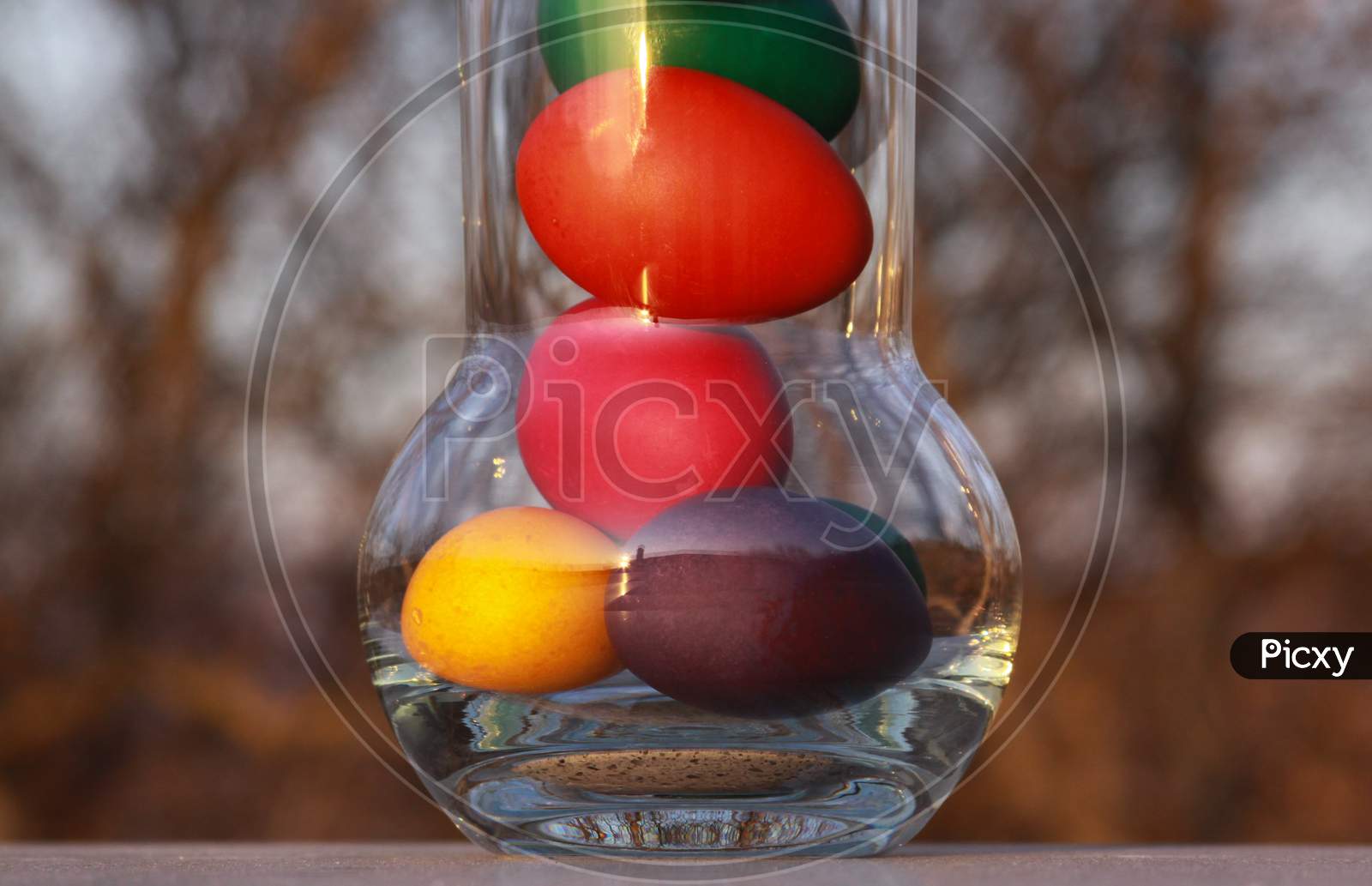 Easter Eggs In Glass Vase Or Carafe Concept Idea