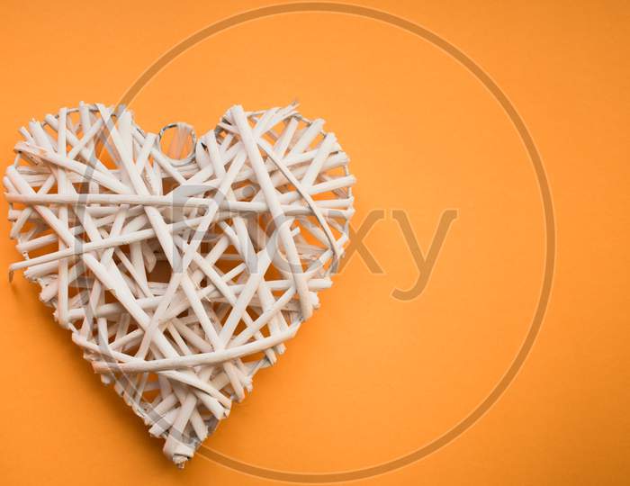 Wooden Heart On Yellow Background For Valentine'S Day.