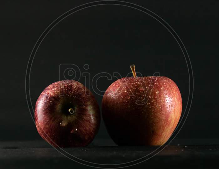 Red Apples On A Black Background