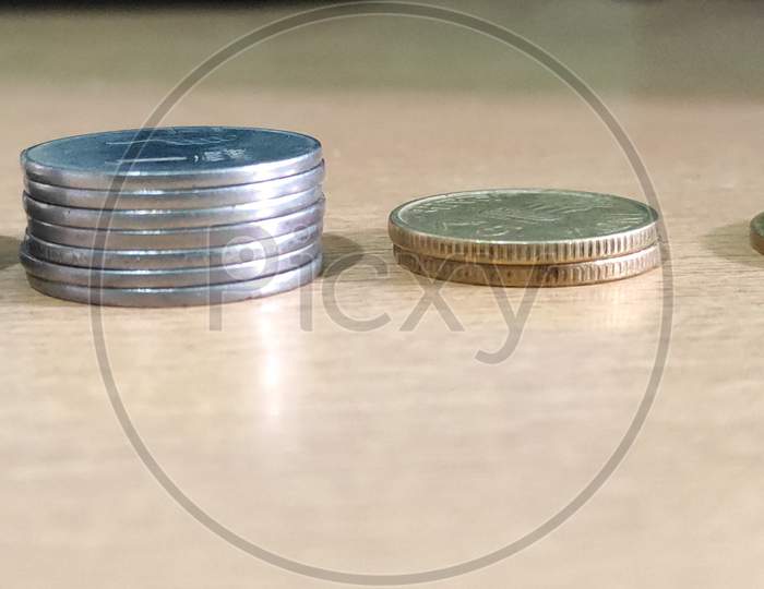 Group of coins on wooden table background, business and finances
