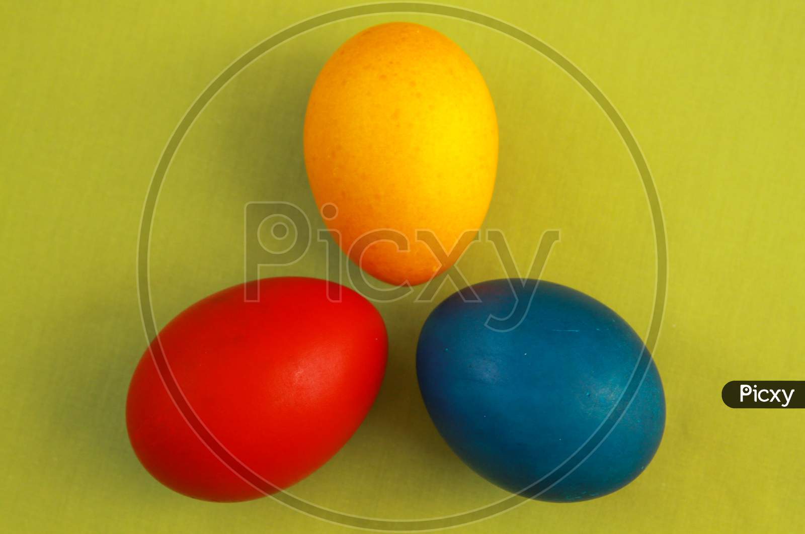 Primary Colors Easter Eggs Green Background