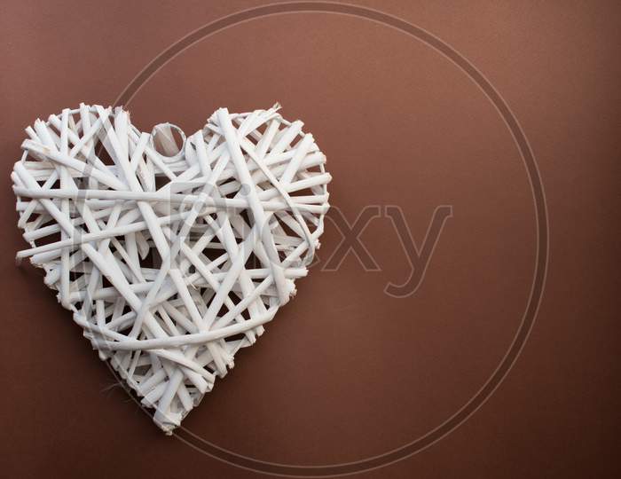 Wooden Heart On Brown Background For Valentine'S Day.