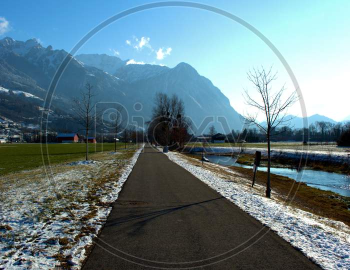 Small River Flows Through The Nature In Vaduz In Liechtenstein 7.1.2021