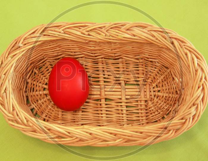 One Easter Egg In Basket