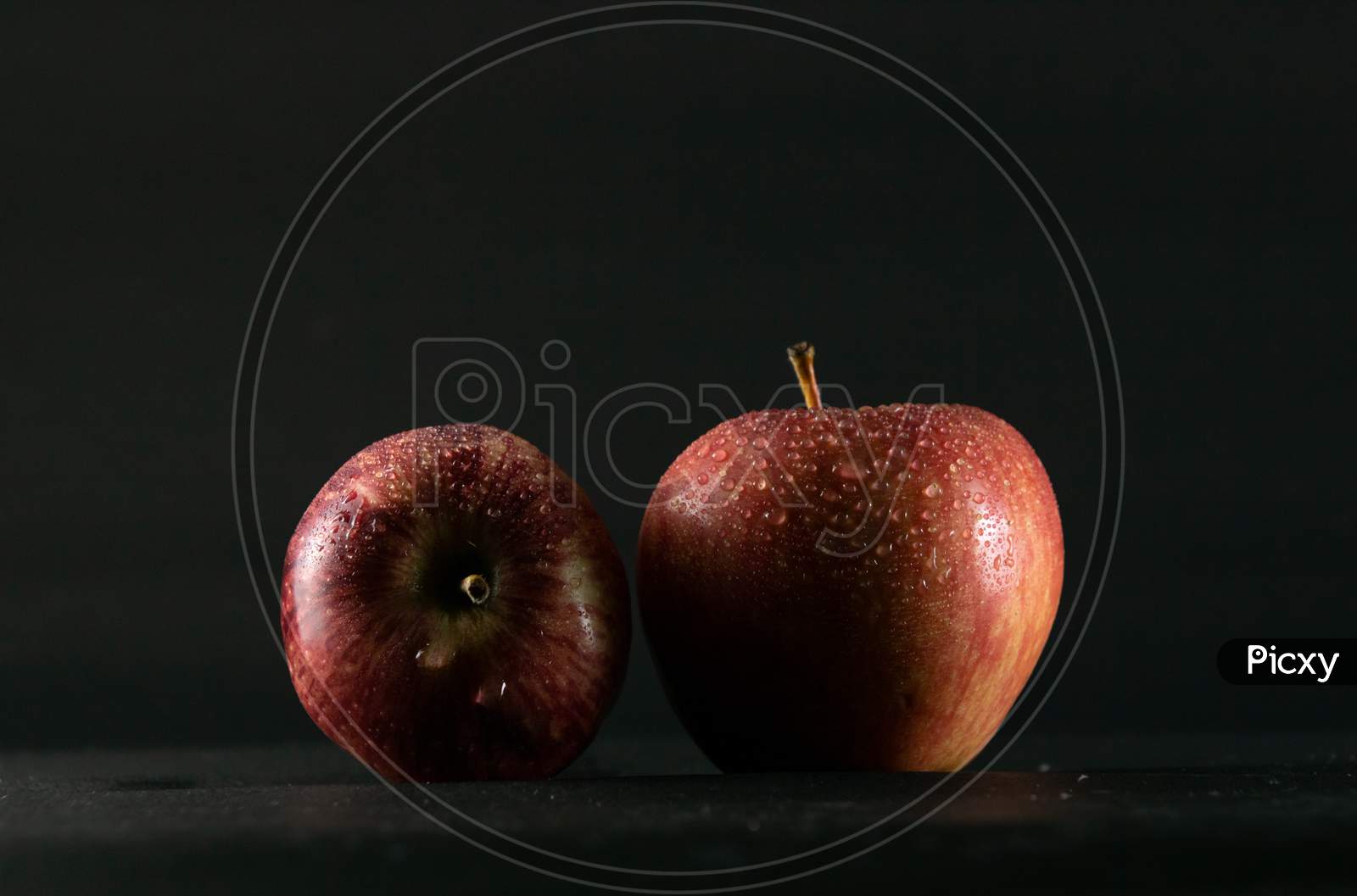 Red Apples On A Black Background