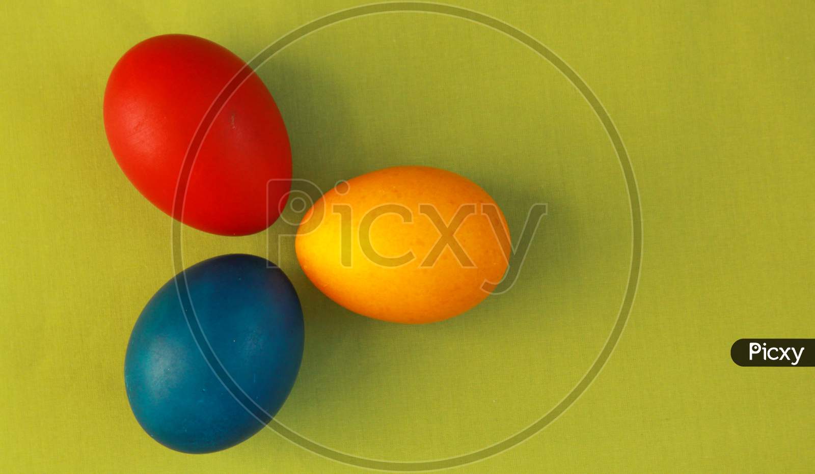 Primary Colors Easter Eggs Green Background