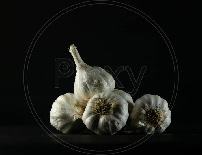 Garlic On Black Background