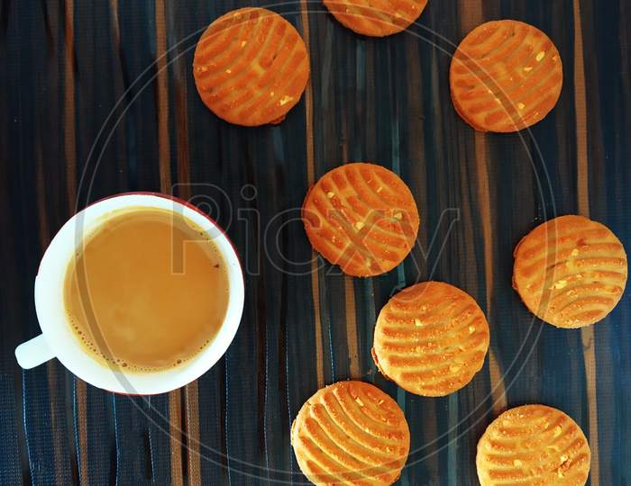 Morning Tea Or Chai Cup With Biscuits On Wooden Table