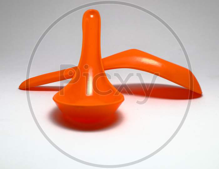 Orange Spoon Isolated On A White Background
