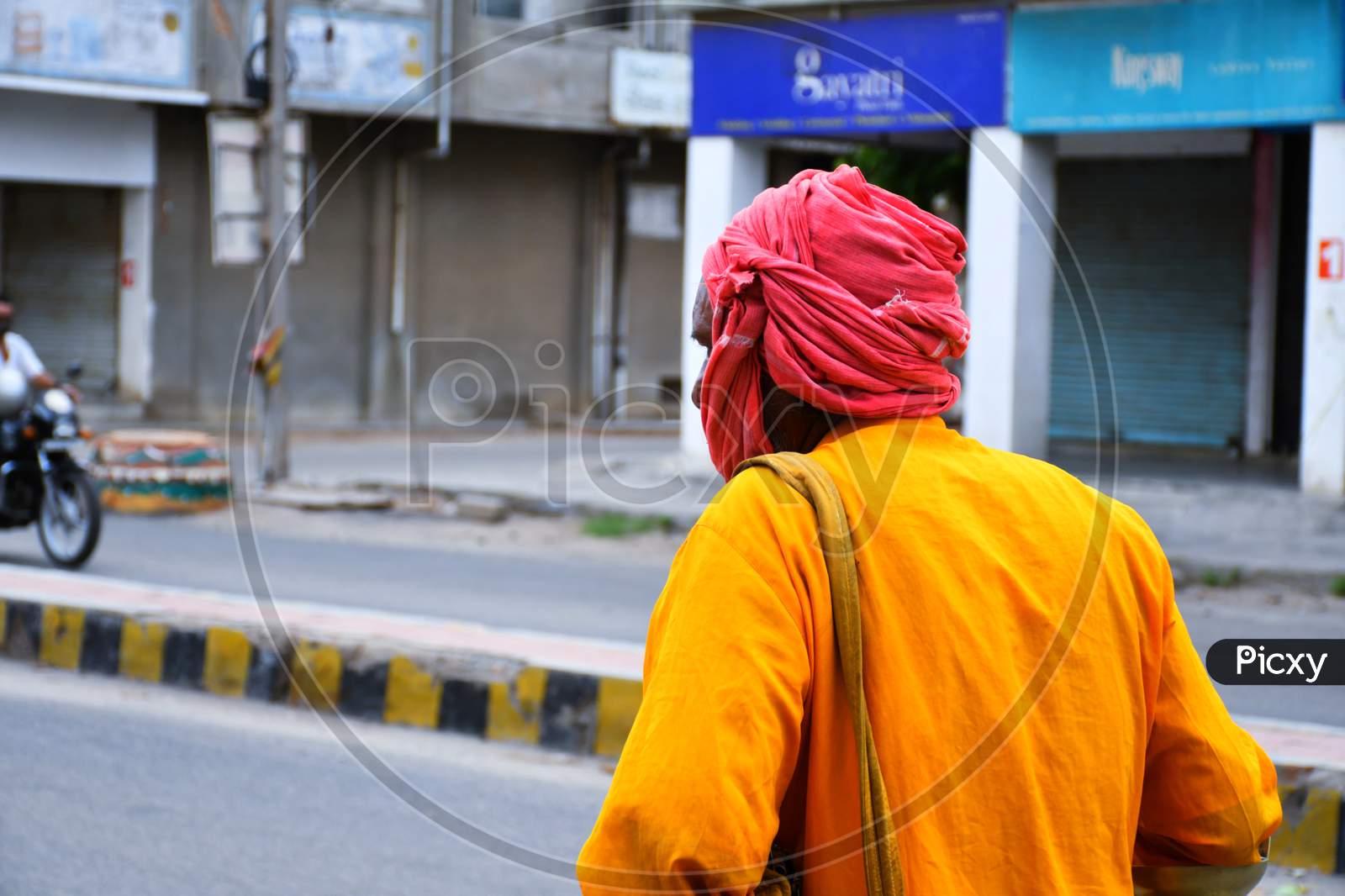 Indian Monk walking on the way in Morning