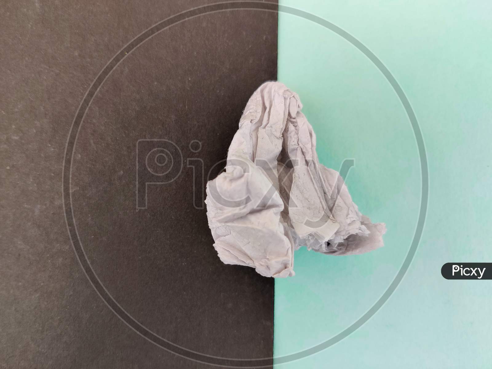 Crushed Tissue Paper Isolated On Green And Black Background