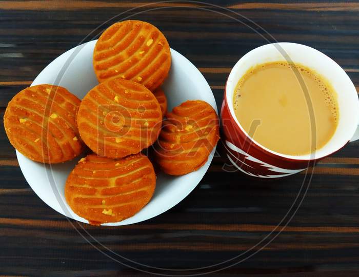 Morning Tea Or Chai Cup With Biscuits On Wooden Table