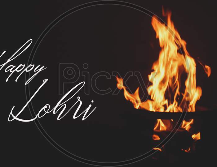 Illustration of Happy Lohri greeting card banner poster wishes message with the fire burning on black background