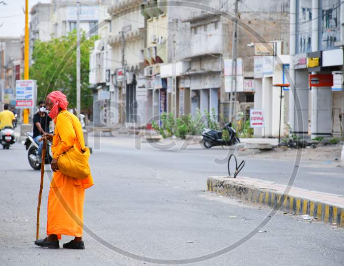 Indian Monk walking on the way in Morning