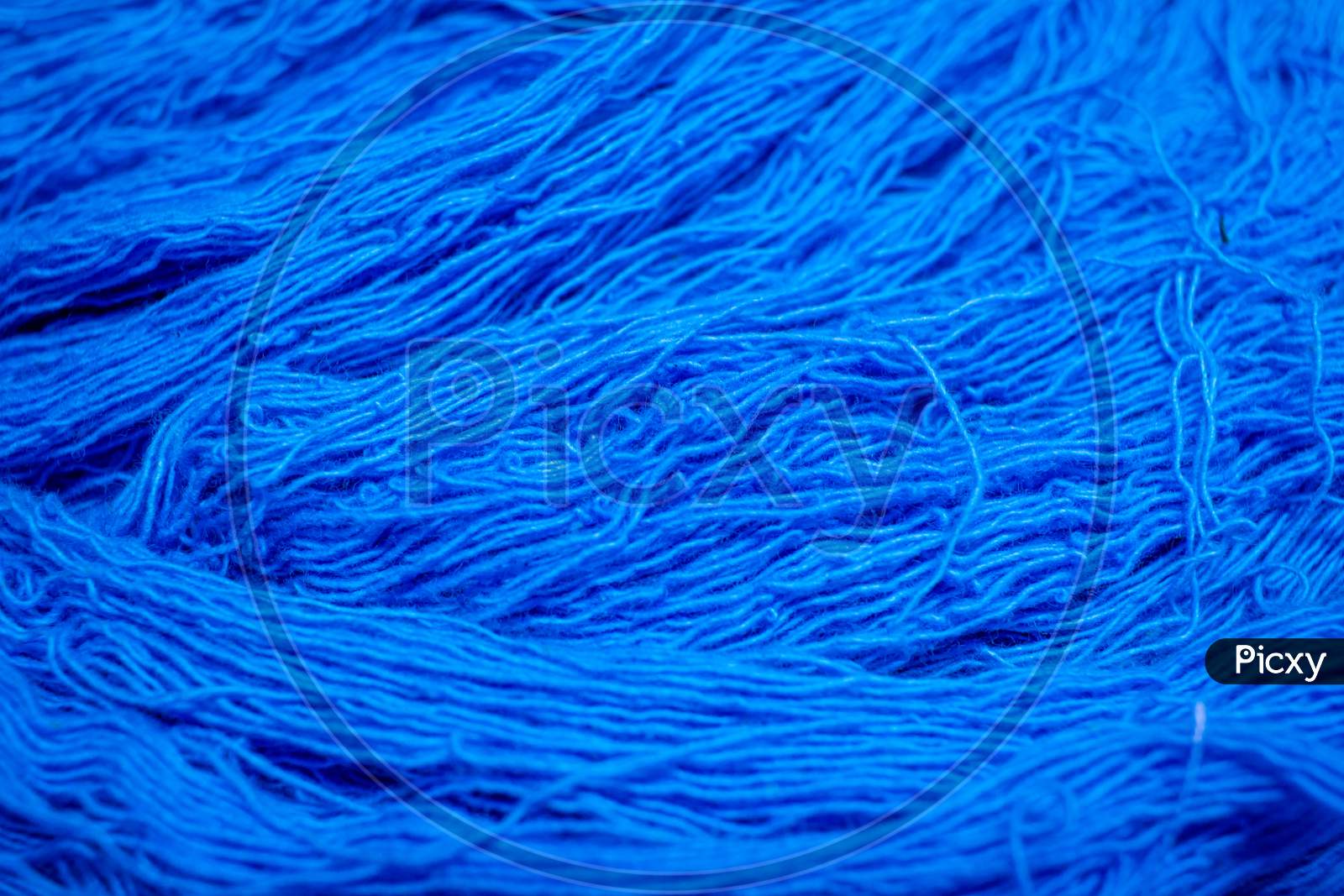 Close View Of The Blue Color Thread Yarns Used In Textile Industry