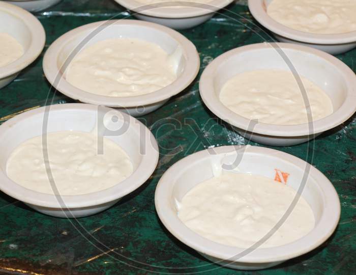 Many White Butter Filled Plates