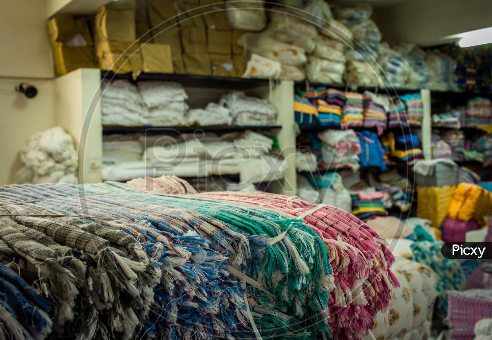 Warehouse Of A Wholesale Textiles Merchant. Warehouse Storing All The Textile Products Like Towels, Yarns And Fabrics.