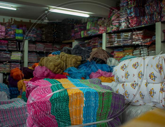 Warehouse Of A Wholesale Textiles Merchant. Warehouse Storing All The Textile Products Like Towels, Yarns And Fabrics.