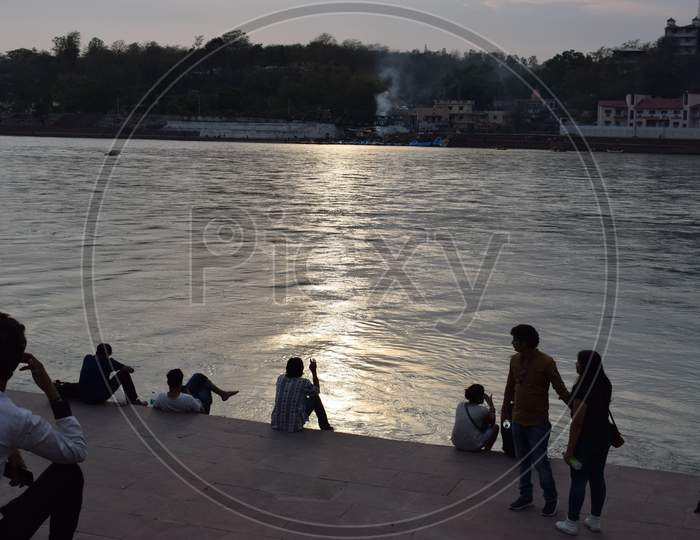 People sitting on River Ganges