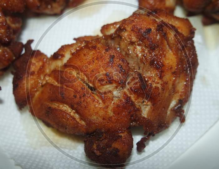 Fried, Grilled Baked Chicken Pieces With Marinated Spices On It